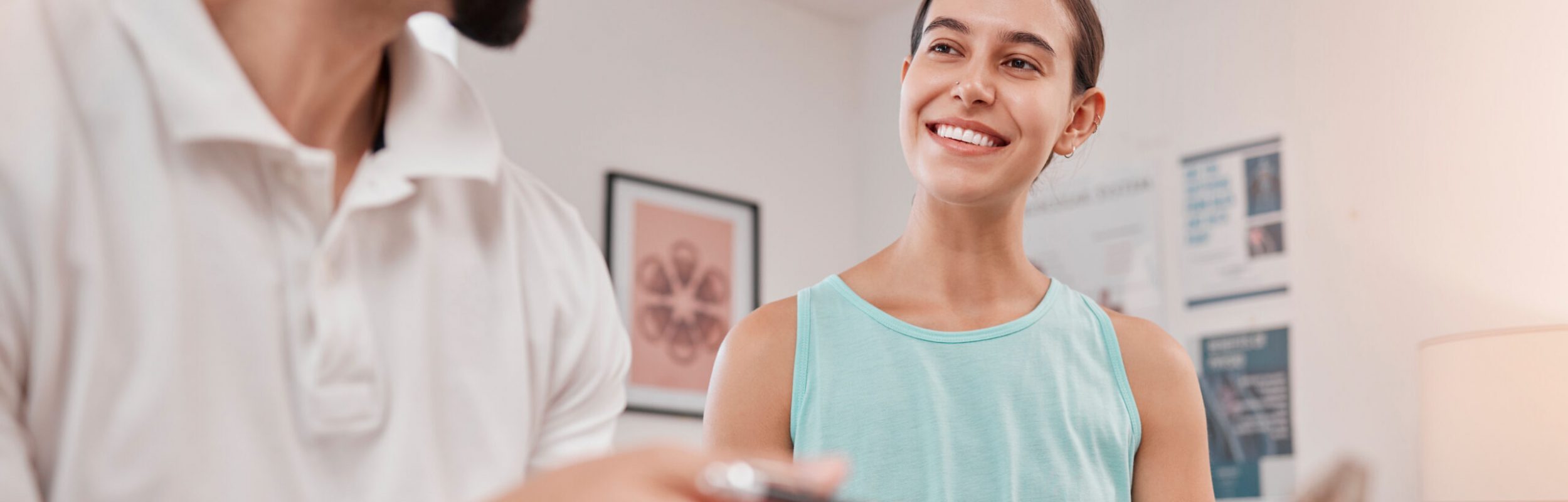 Physical therapy, exam and healthcare man with woman in massage office, clinic or wellness room for.